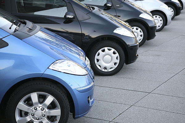 new cars parked in a row new cars parked in a row