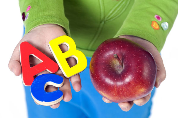 education picture - student with red apple and abc letters